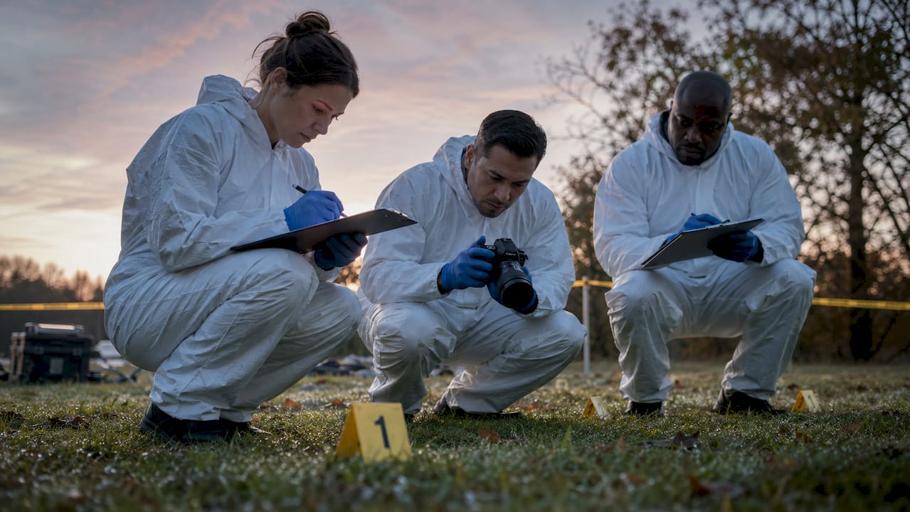 Forensic team documenting an outdoor crime scene