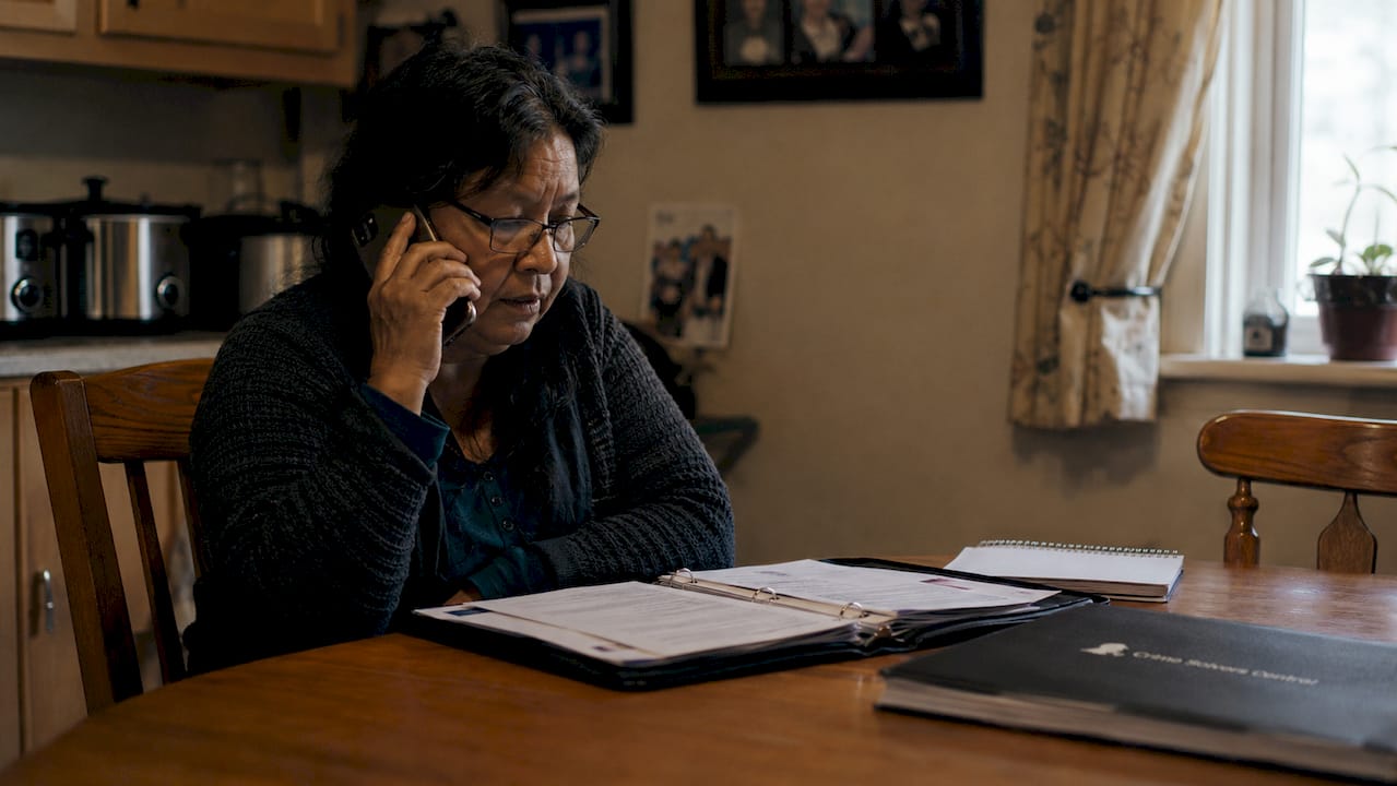 Indigenous woman making calls to law enforcement