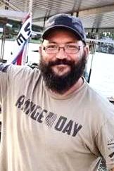 John McAfee death by force case profile photo